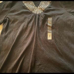 Ladies short sleeve top. white embroidery look dresses up this black tee
